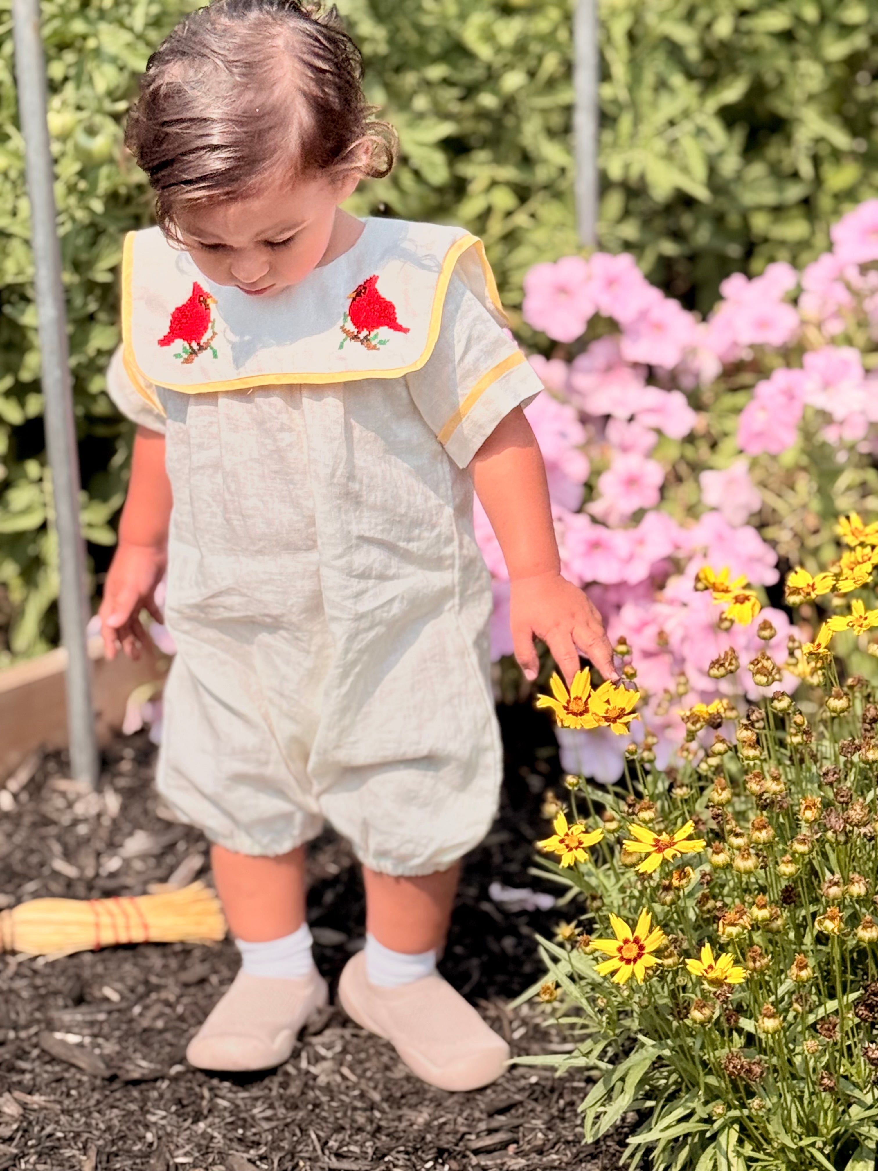 Cardinal Romper 100% natural linen and adorned with an artisan-embroidered cardinal bird