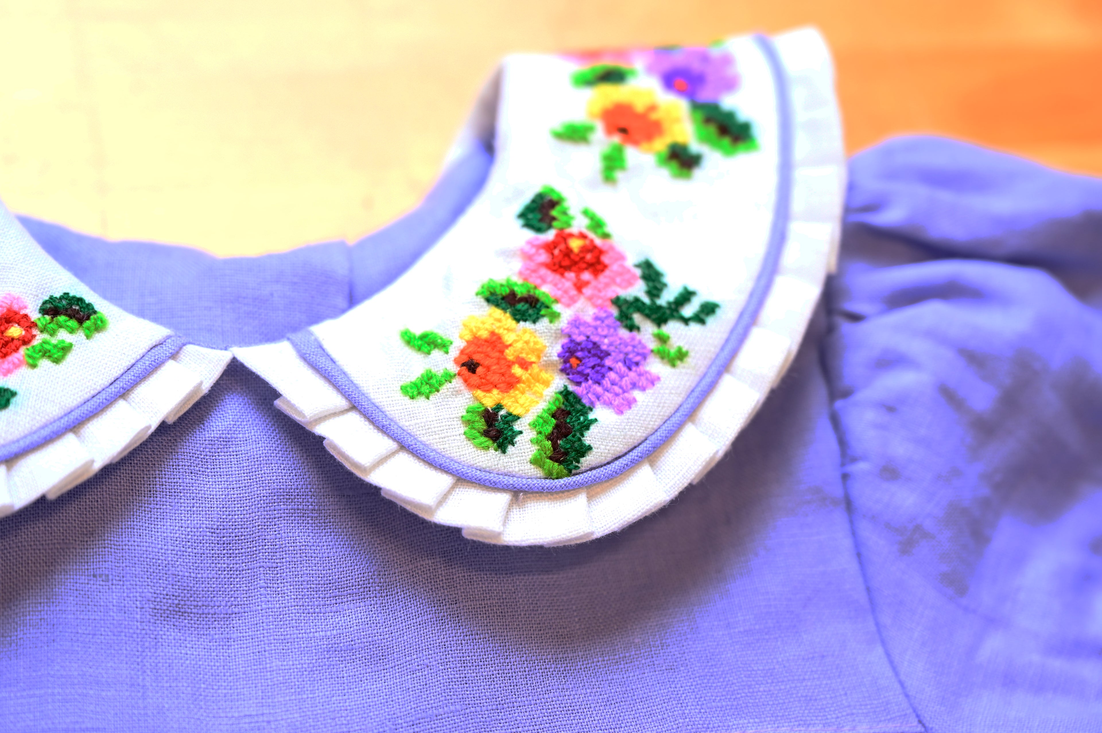 Mamilu Crafted from 100% natural linen and adorned with an artisan-embroidered