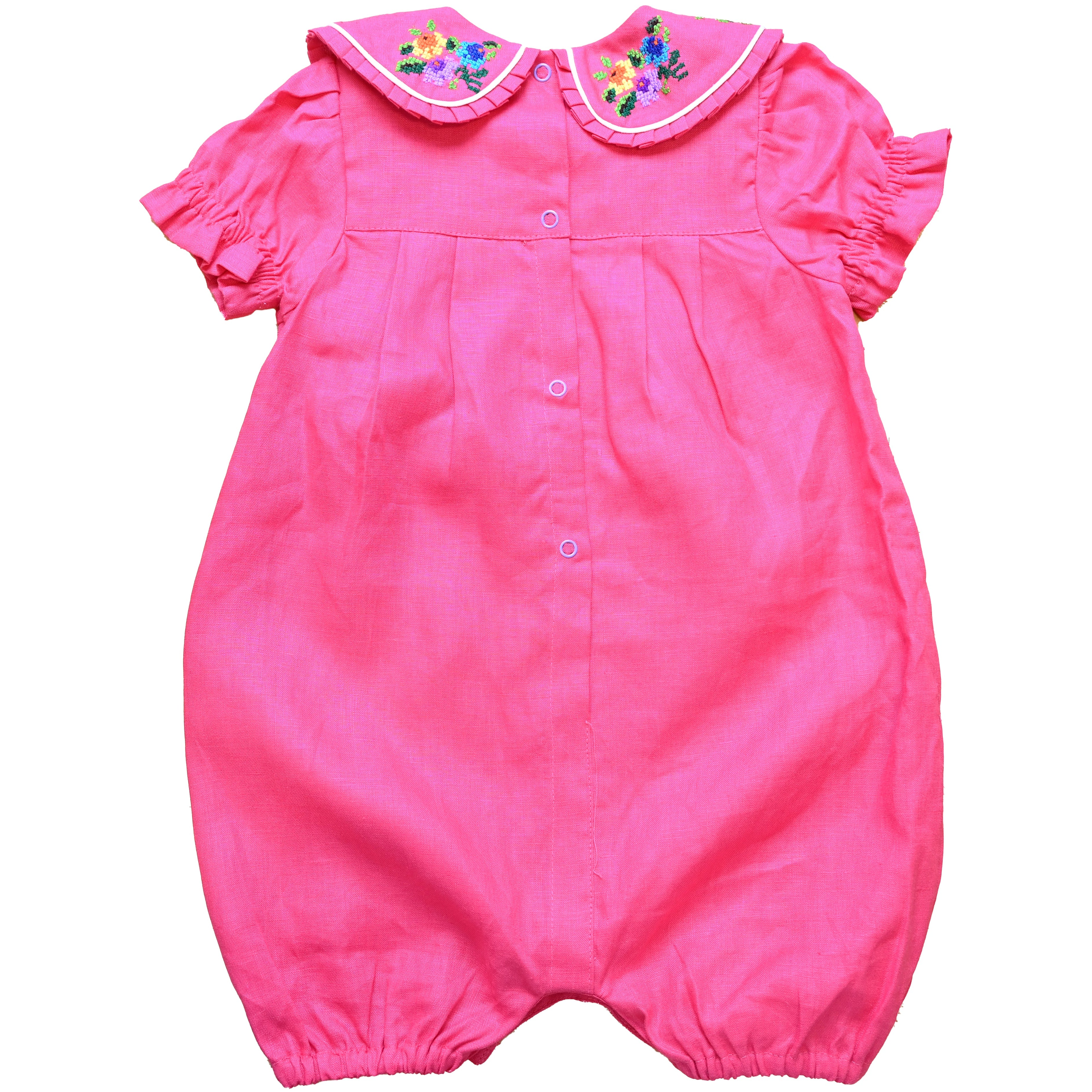 Mamilu Crafted from 100% natural linen and adorned with an artisan-embroidered