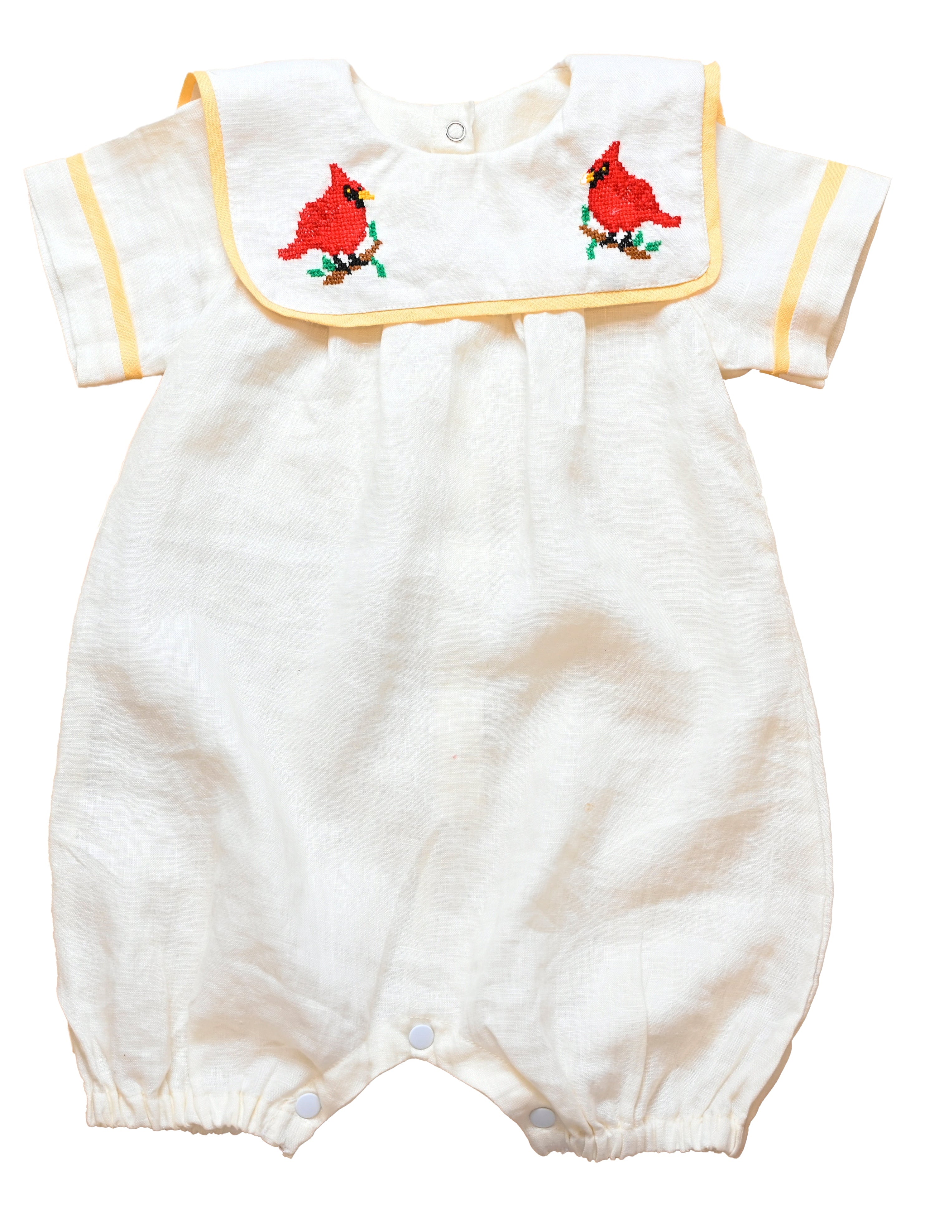 Cardinal Romper 100% natural linen and adorned with an artisan-embroidered cardinal bird
