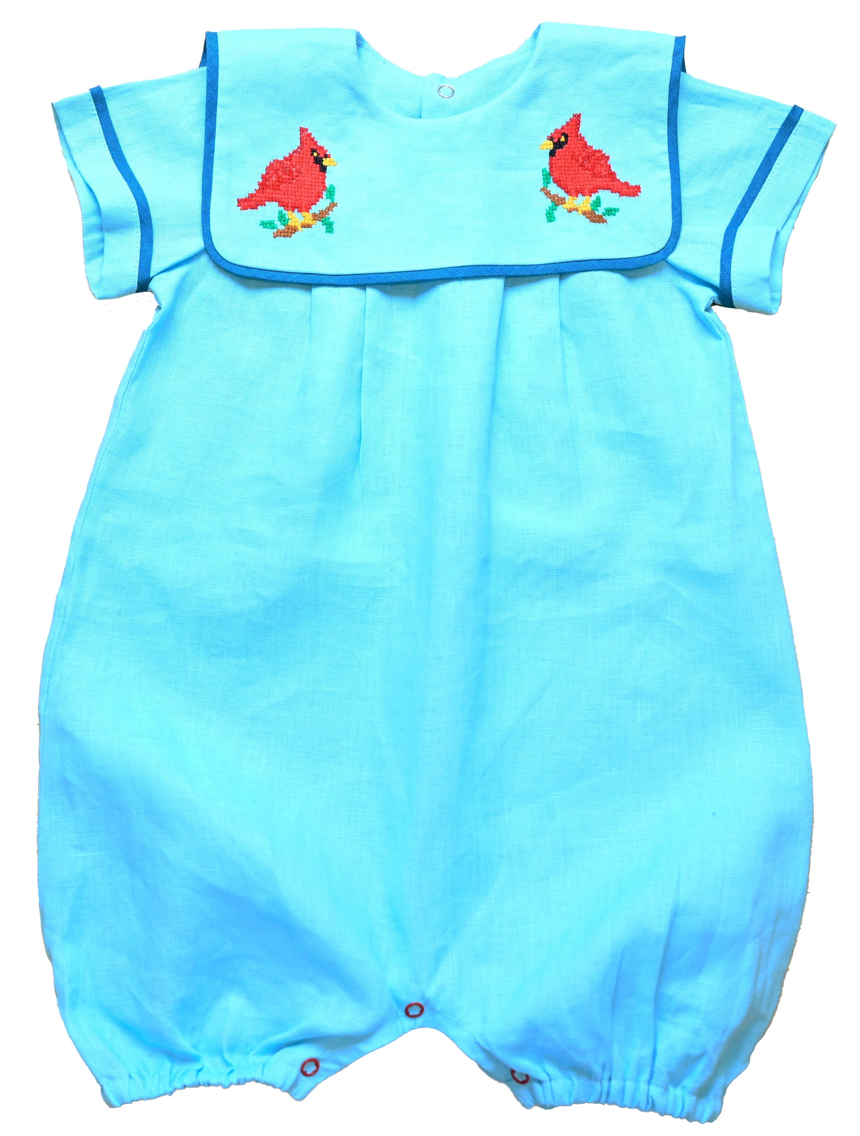 Cardinal Romper 100% natural linen and adorned with an artisan-embroidered cardinal bird