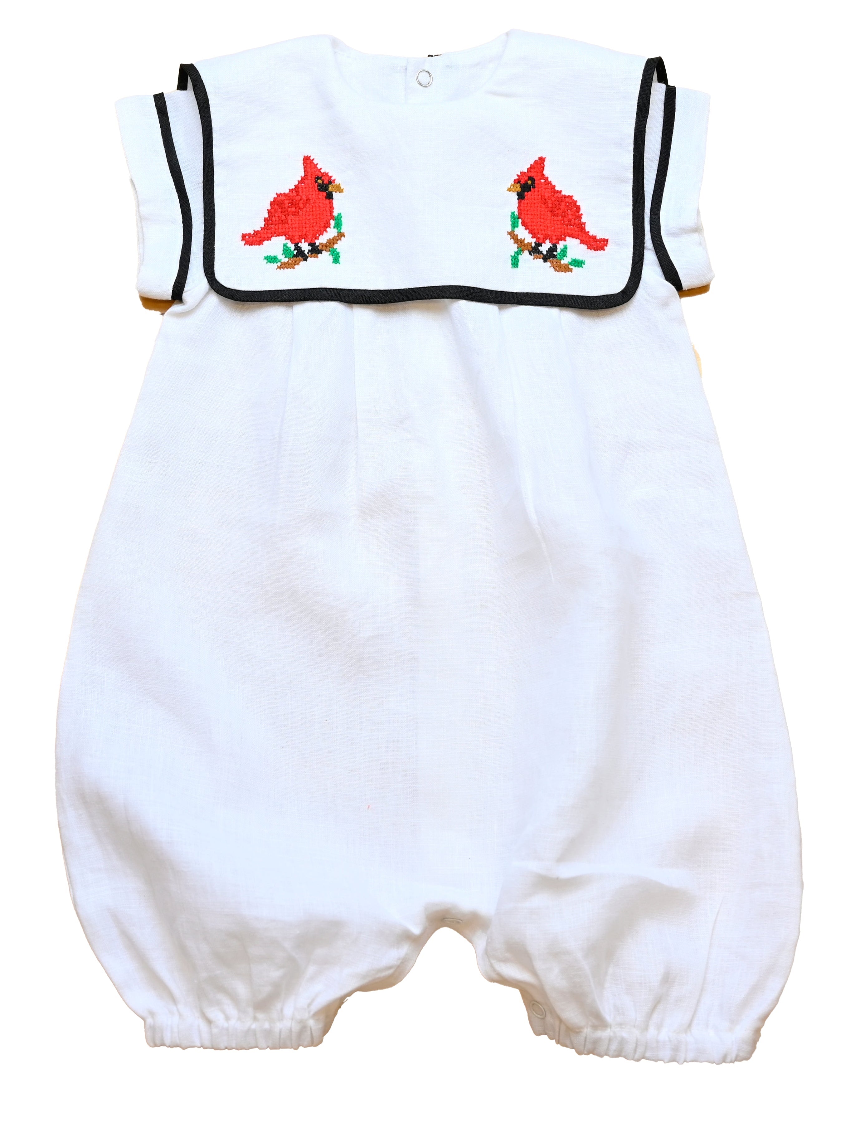 Cardinal Romper 100% natural linen and adorned with an artisan-embroidered cardinal bird