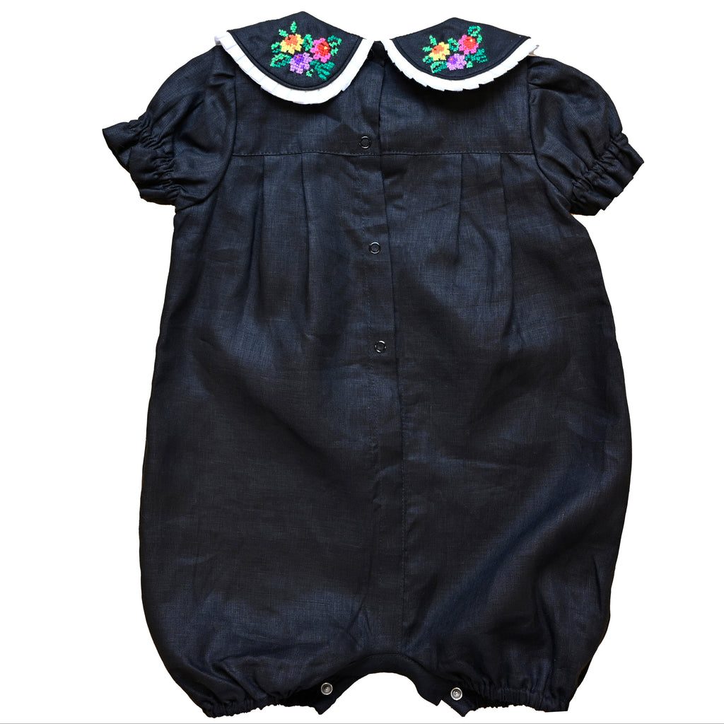 Mamilu Crafted from 100% natural linen and adorned with an artisan-embroidered