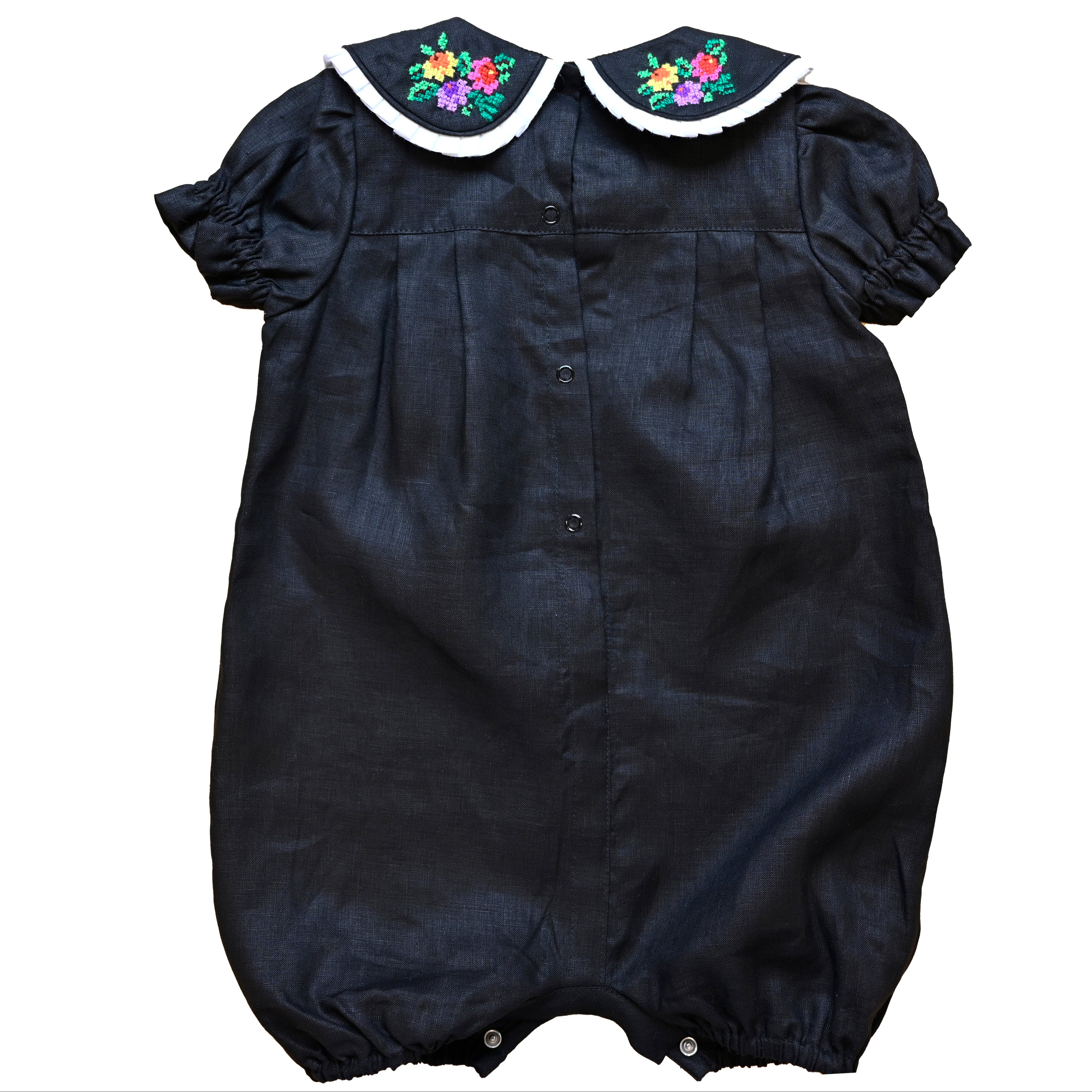 Mamilu Crafted from 100% natural linen and adorned with an artisan-embroidered